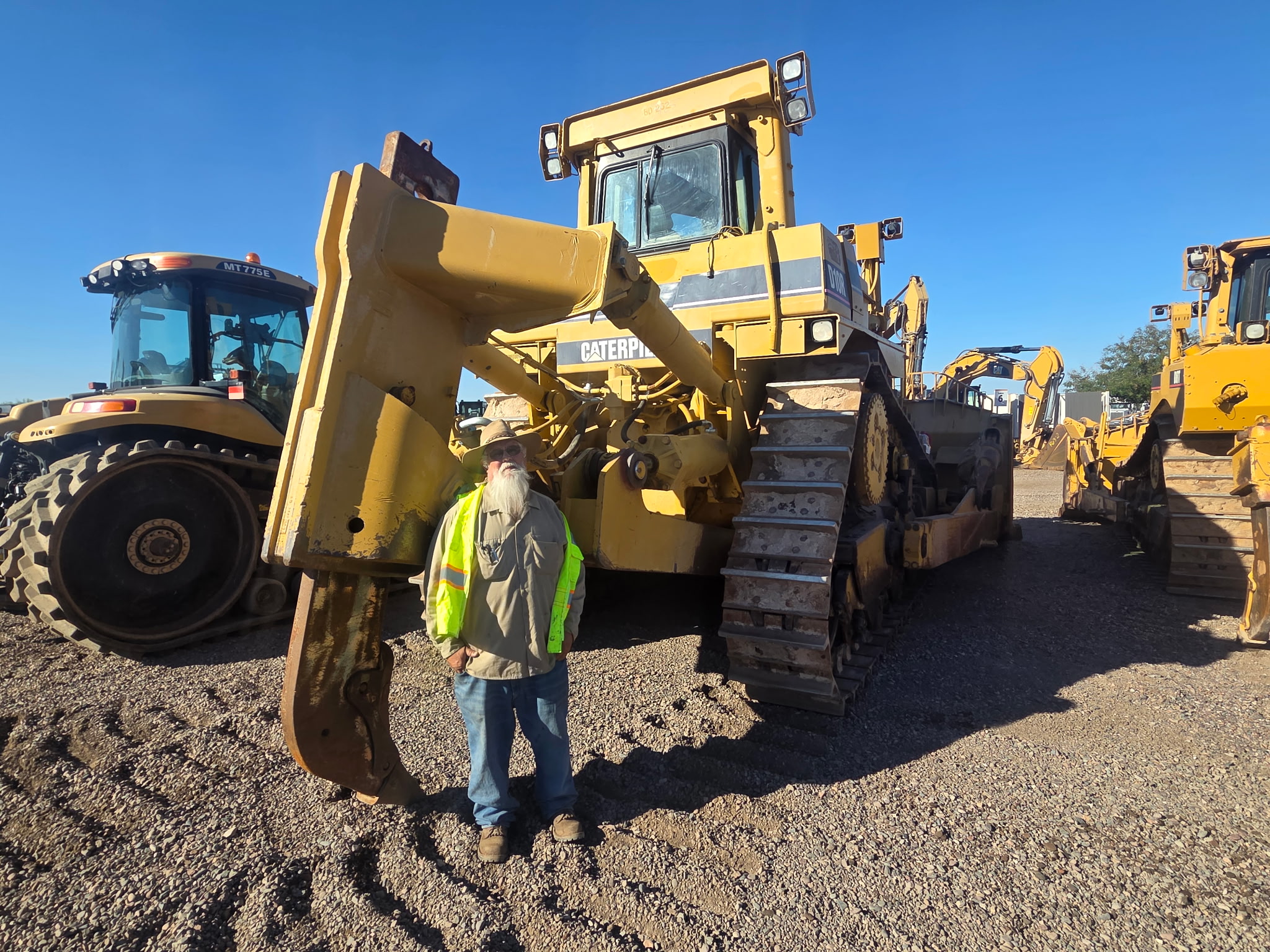 Crew standing with the dozer at the yard