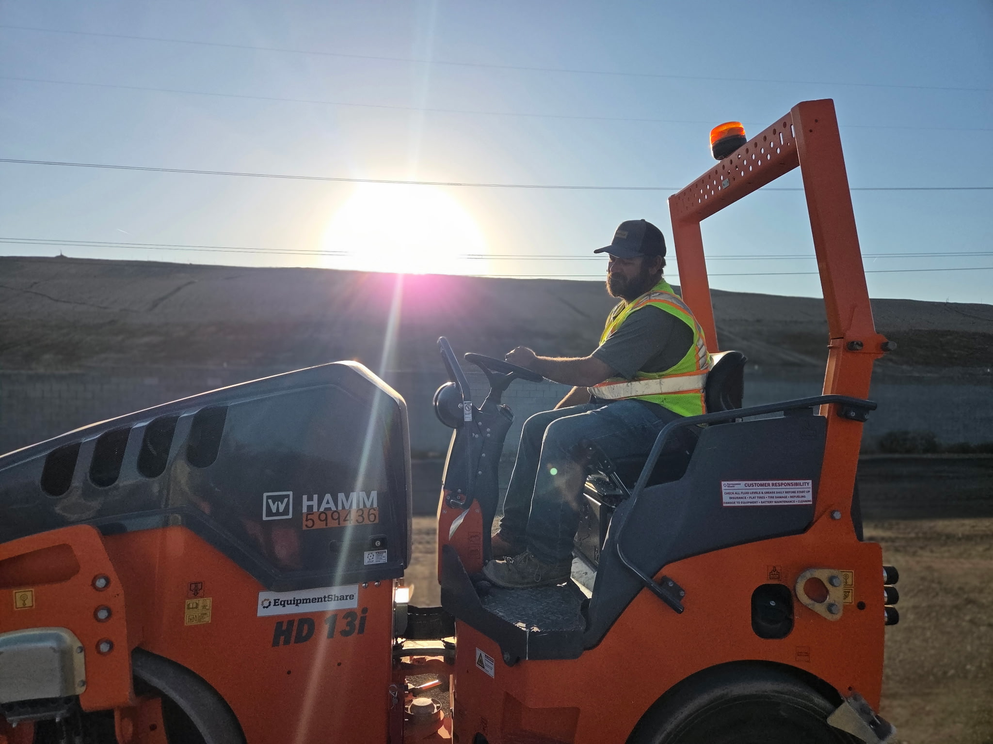 HAMM roller working into an Arizona sunset