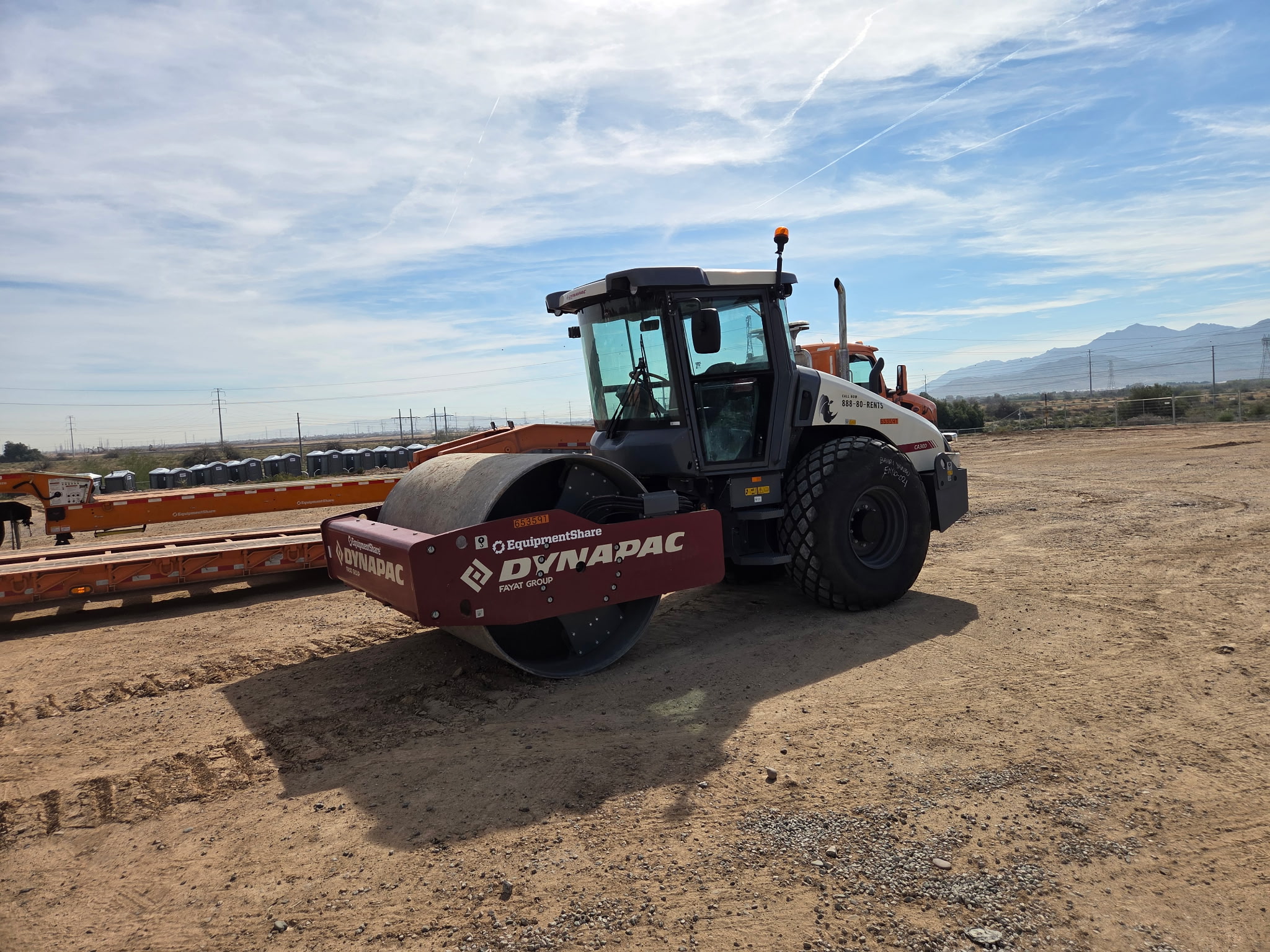 Dynapac vibratory roller compacting a pad