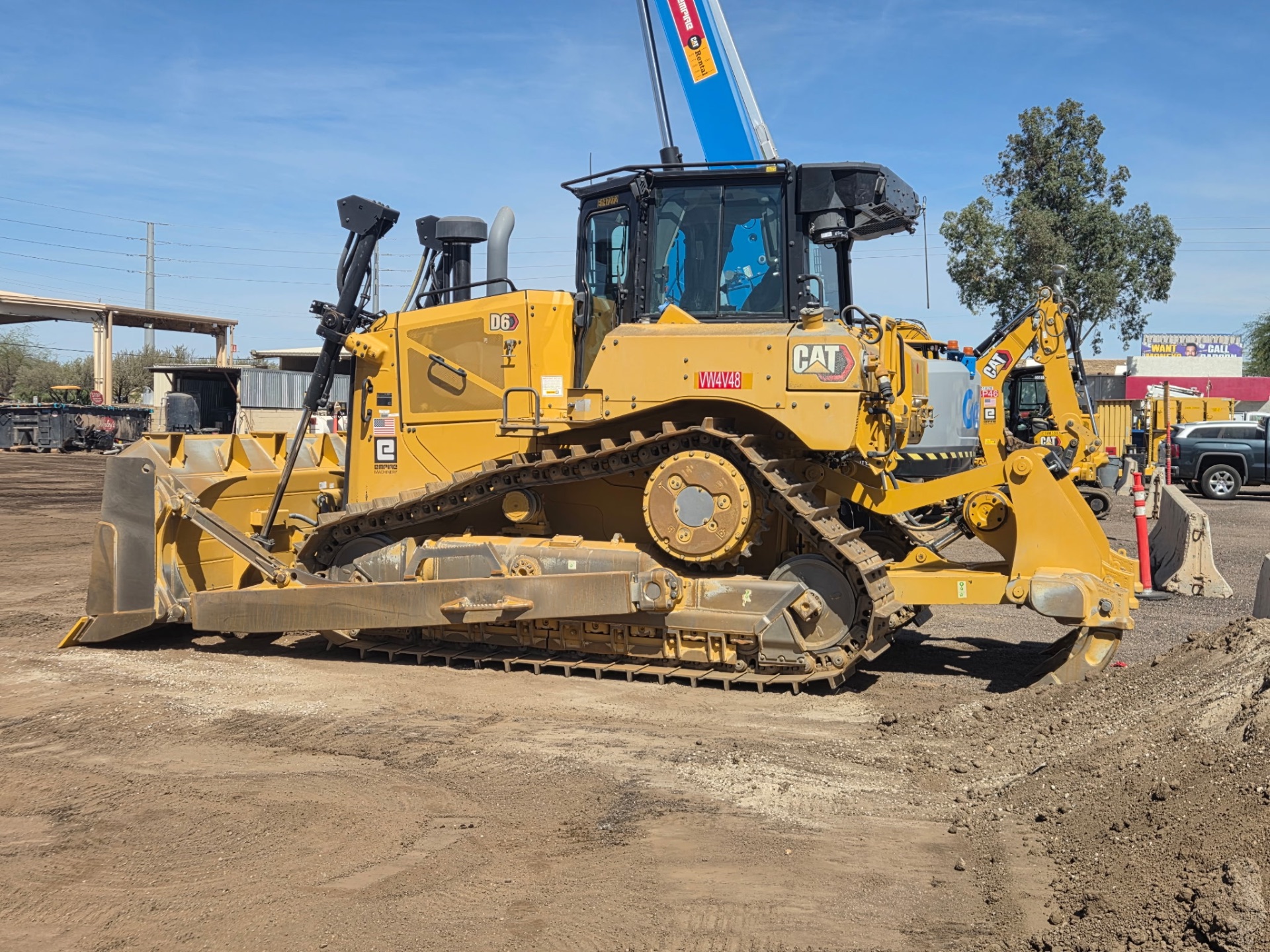 CAT D6 dozer with hydraulic tilt-arm blade on the yard