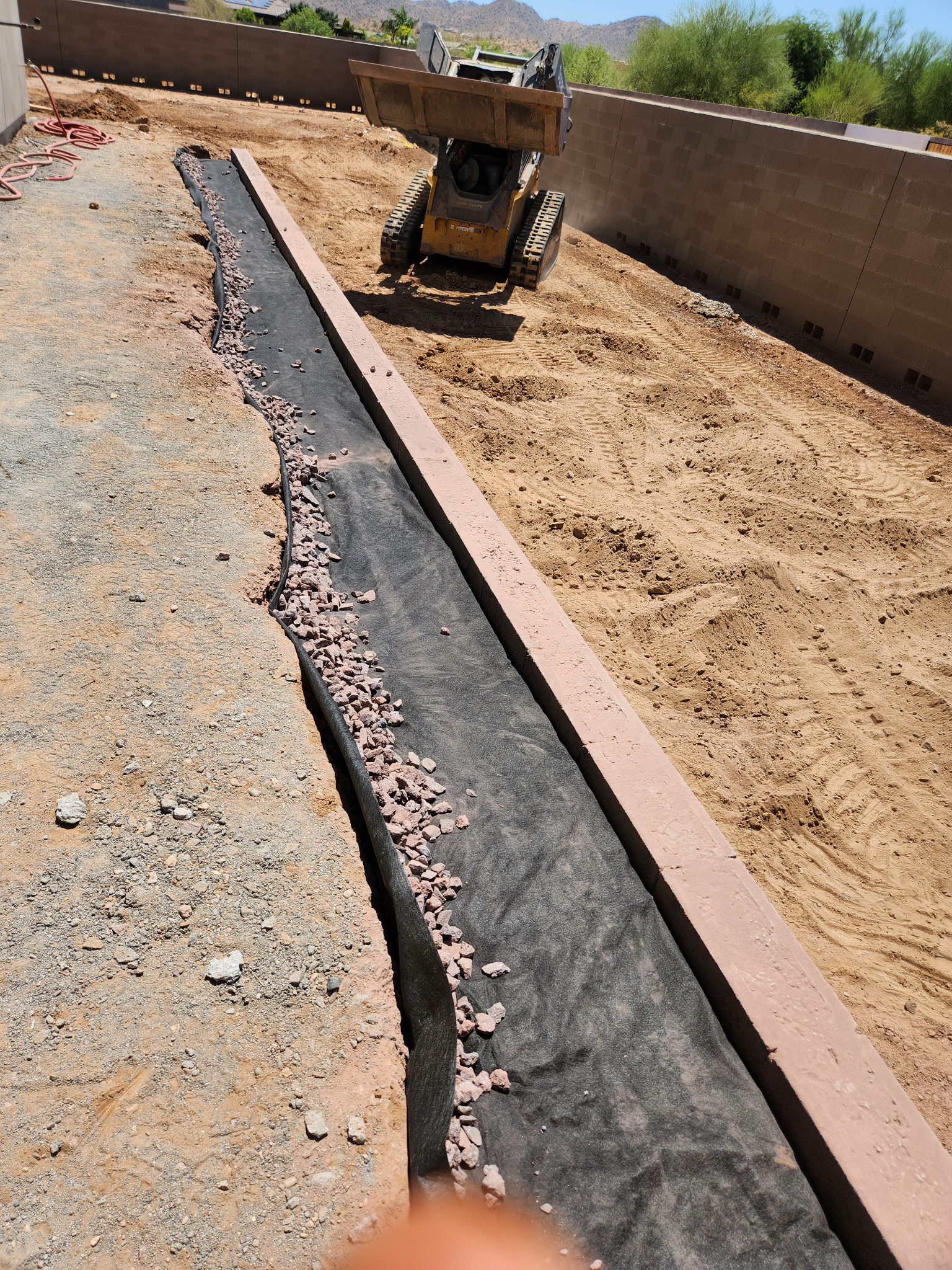 Trench edge with rebar and gravel on a new build