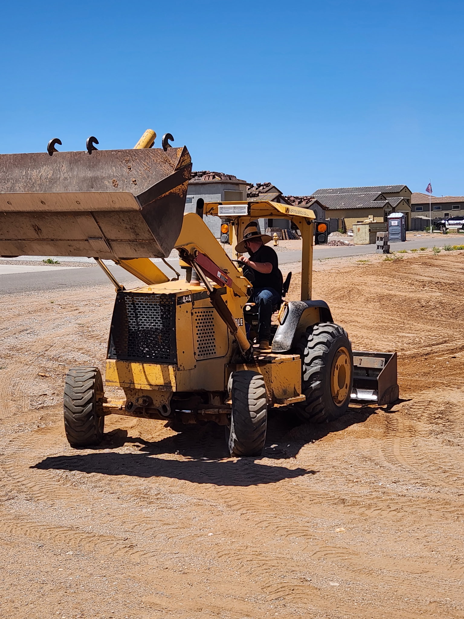 CAT loader loading a dump truck at the yard