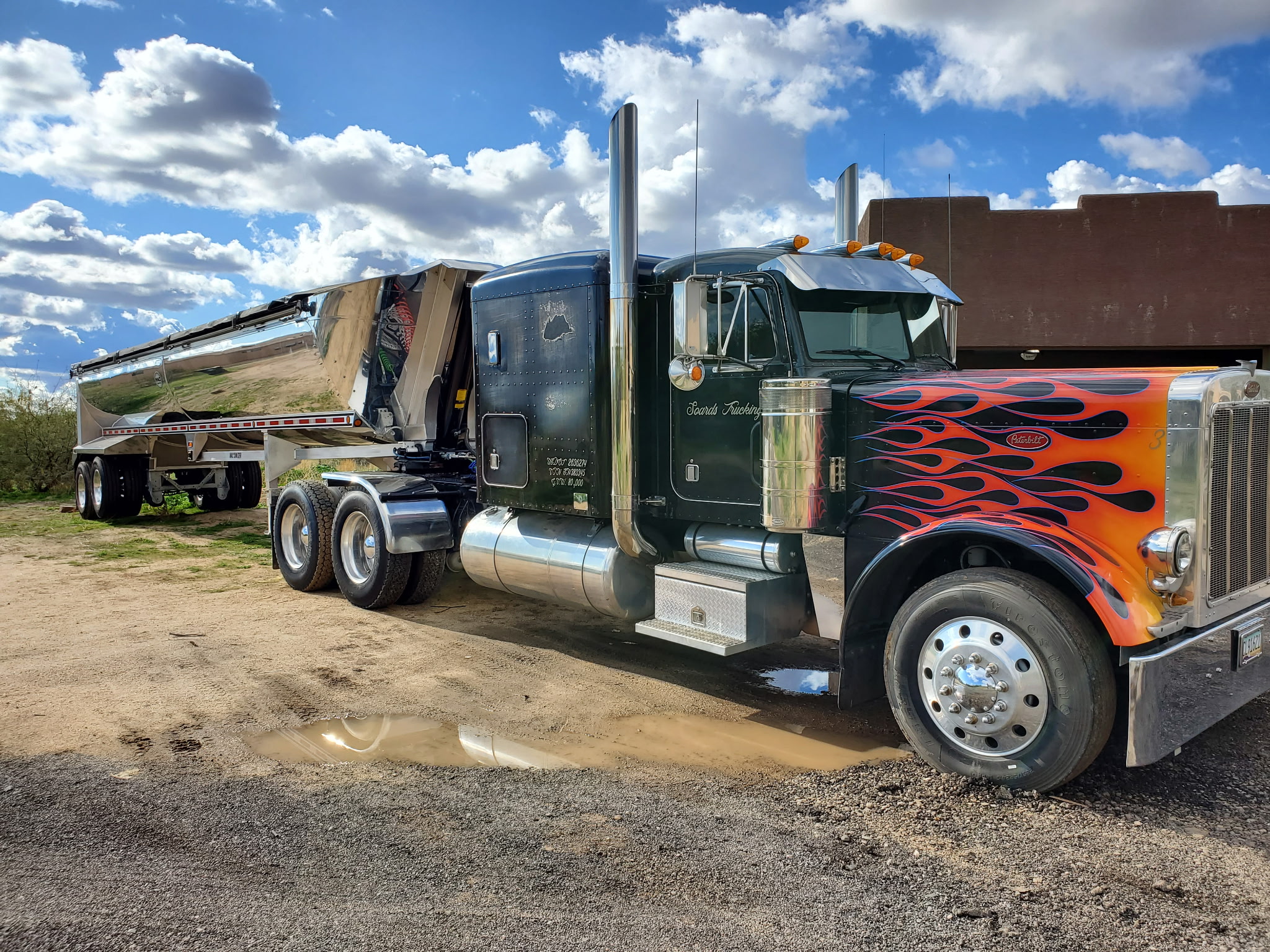 Flamed Peterbilt hauling on a rural Arizona road